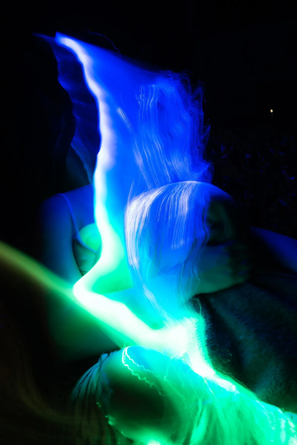 Blue green light painting around head