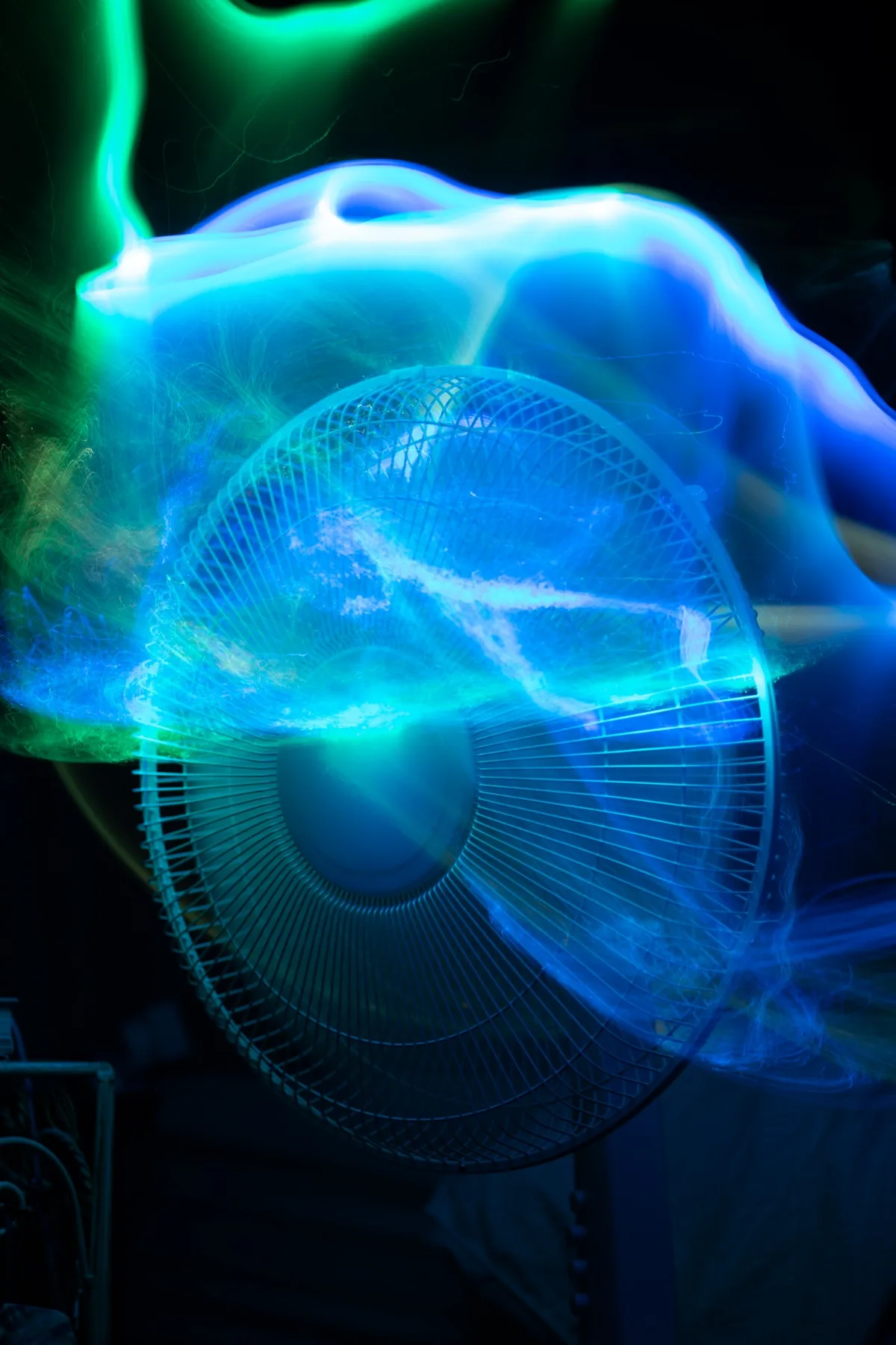 Blue green light painting over fan